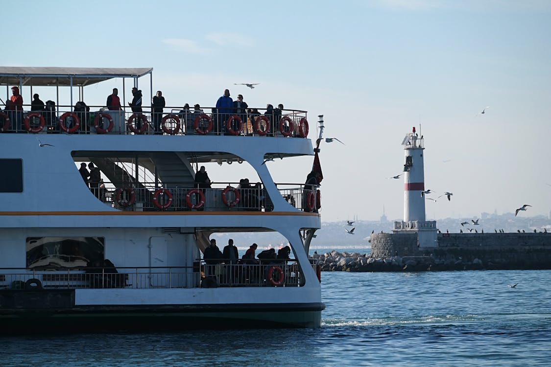 People Riding White Ferry Boat · Free Stock Photo