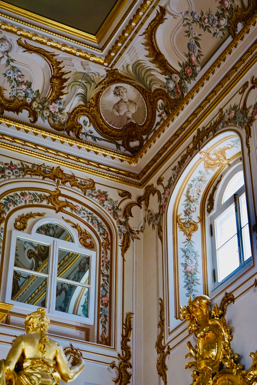 Free A lavishly decorated Baroque interior featuring intricate ornate murals and gold embellishments. Stock Photo
