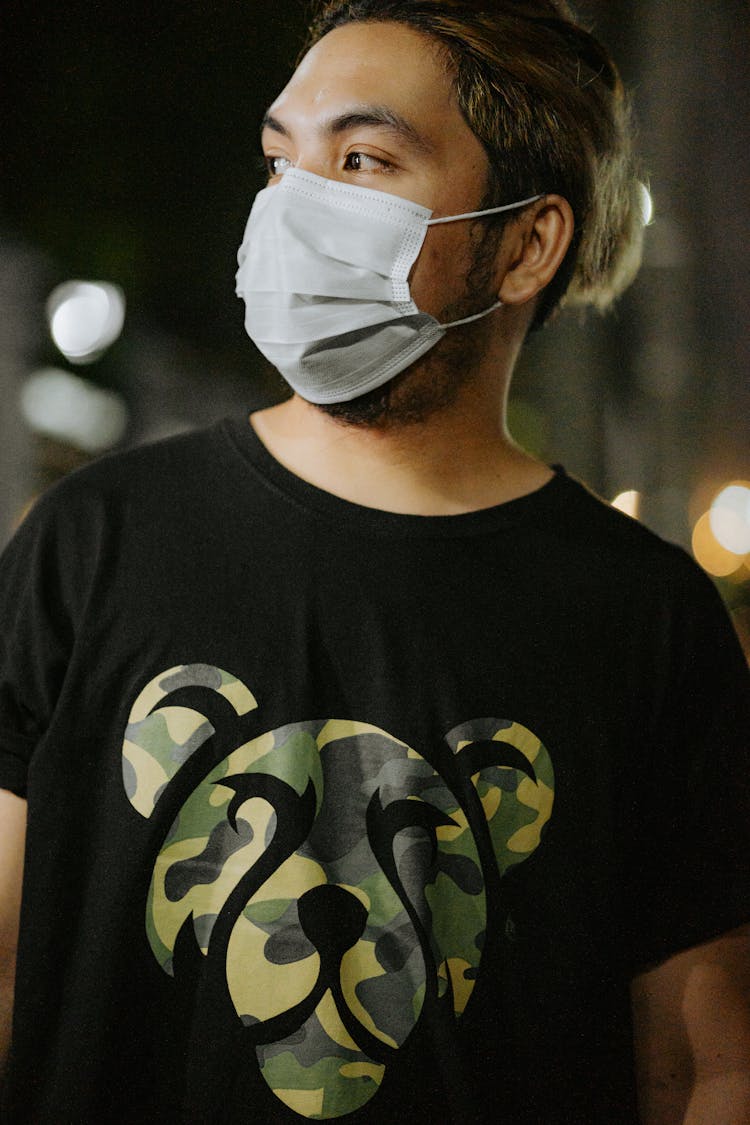 Man In Black Crew Neck T-shirt Wearing White Face Mask