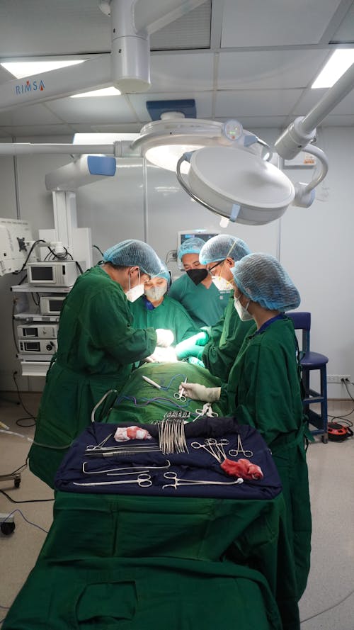Free Doctors Performing a Surgery Stock Photo