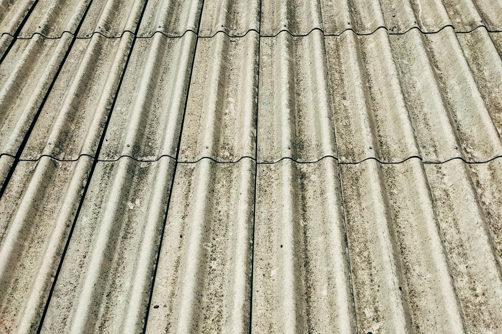 Detailed close-up of a corrugated concrete roof showcasing texture and pattern.