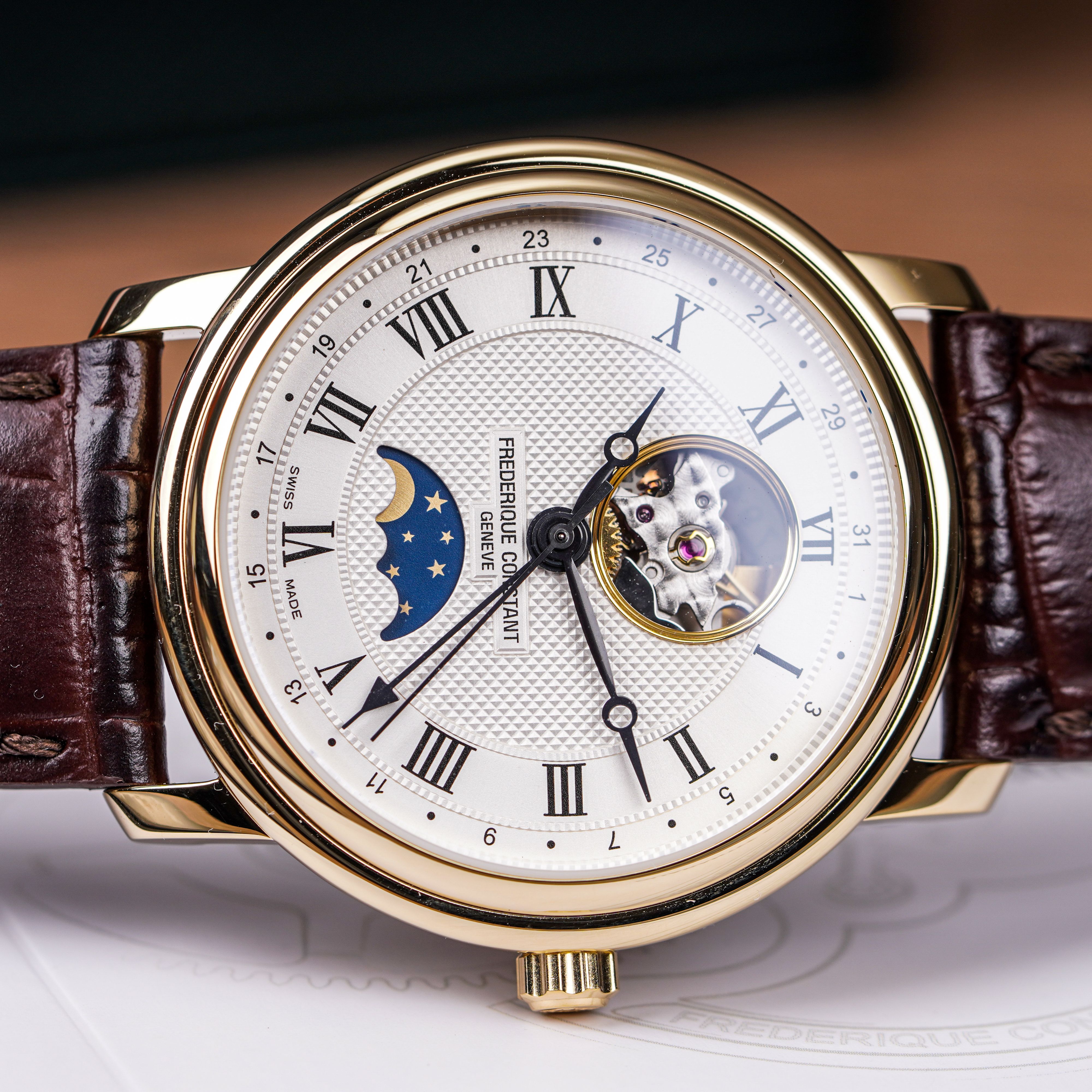 Vintage Omega chronograph with Roman numerals held in hand