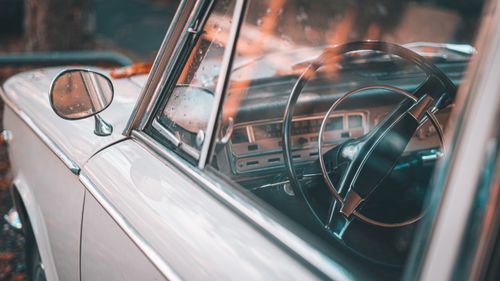 Free Detailed shot of a vintage Fiat car's steering wheel and interior with retro style. Stock Photo