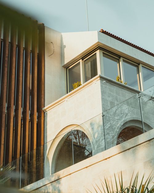 Free Elegant building exterior featuring modern architecture and large windows. Stock Photo