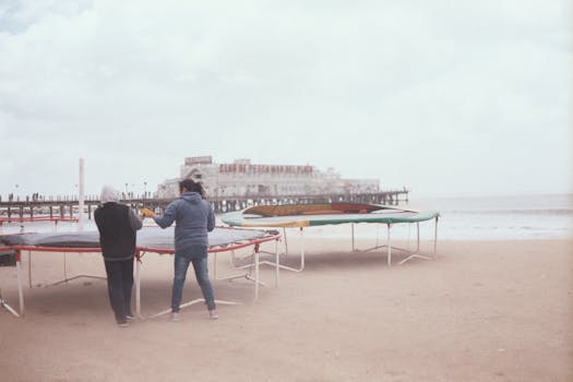 People setting up trampolines on the beach near Club de Pesca Mar del Plata, Argentina.