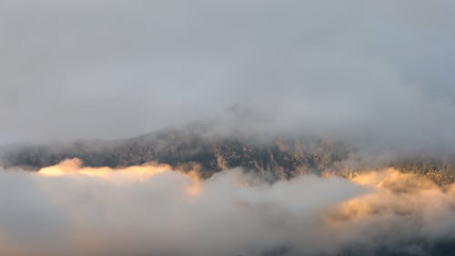 Mountain Covered with White Clouds