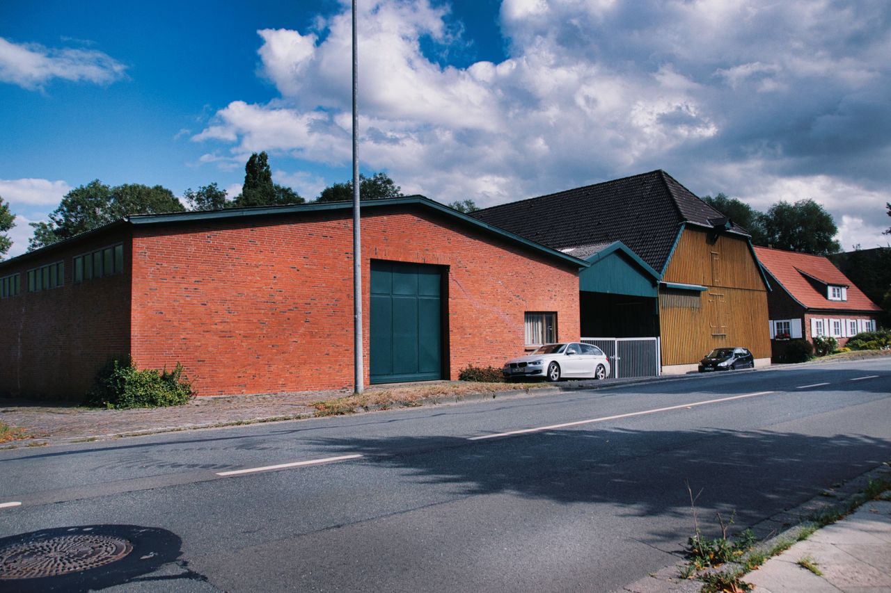 a scenic view of brick structures in a rural setting under a clear sky