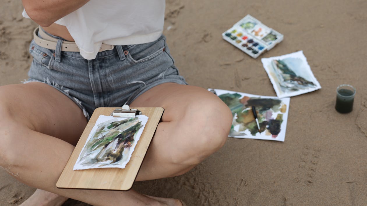 A Woman painting on White Paper