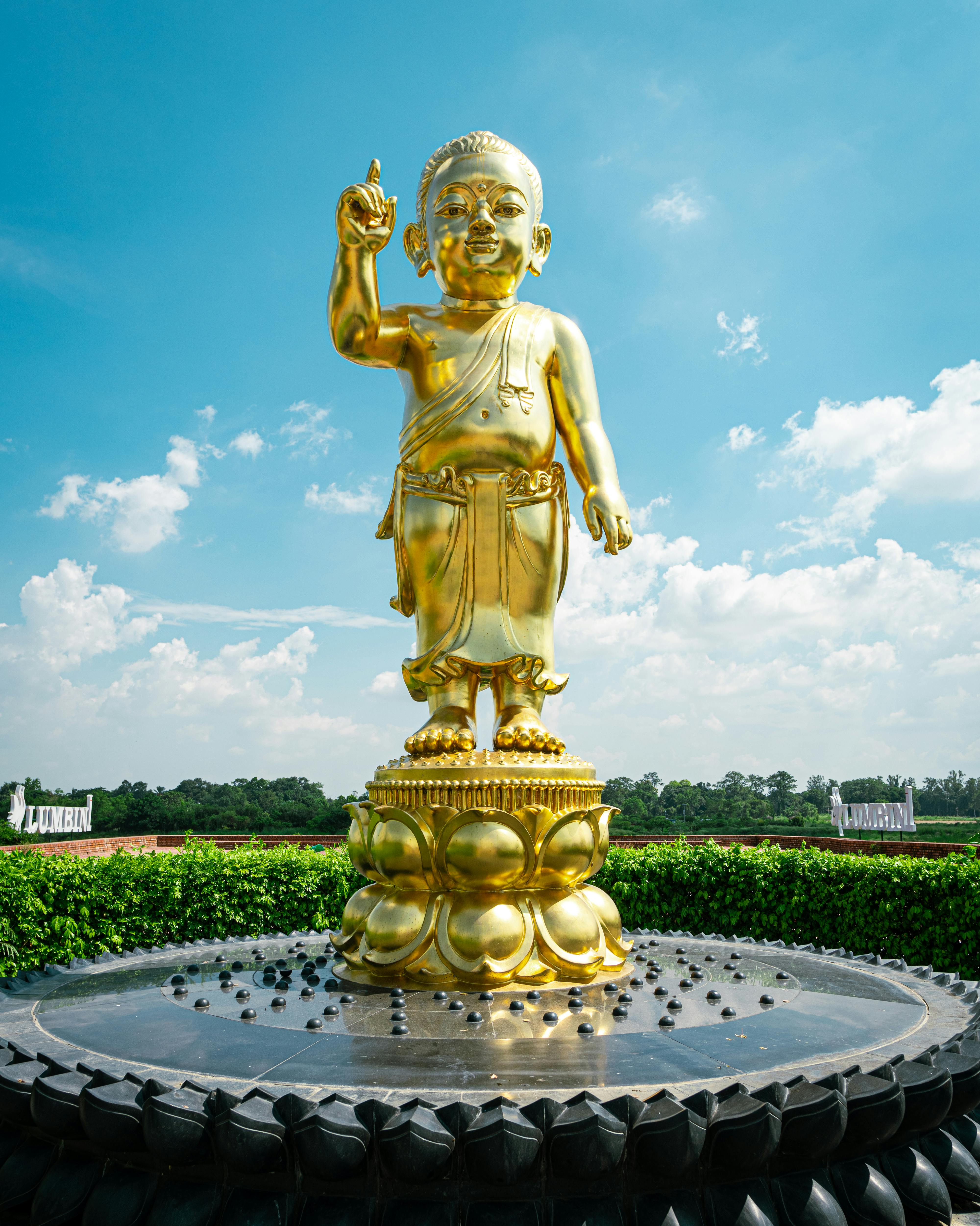 golden buddha statue in a fountain