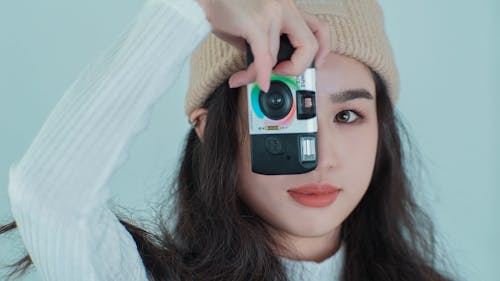 Close-Up Shot of a Woman Taking a Picture