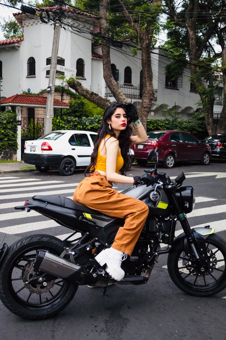 A Woman Riding A Benelli Leoncino 250