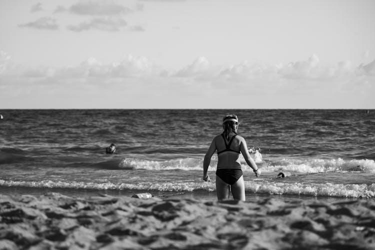 Girl In Black Bikini On Beach