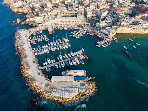 Free Aerial photograph of Acre harbor, showcasing boats and yachts by the waterfront in Israel. Stock Photo