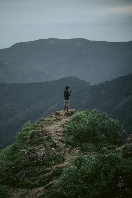 A Man Standing on the Mountain