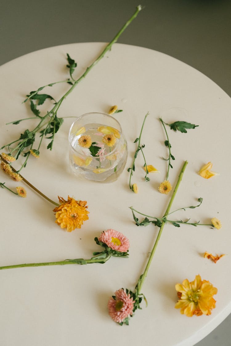 Flowers On Plate And In Water Glass