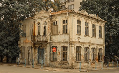 Free Aged and weathered building with a balcony and no entry sign. Stock Photo