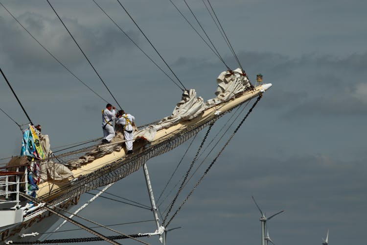 Men Fixing The Sailing Ship