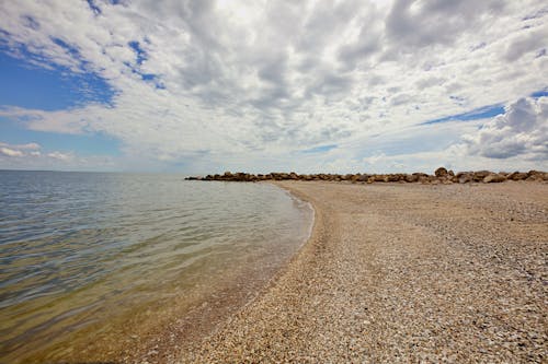 Seashore Under White Clouds