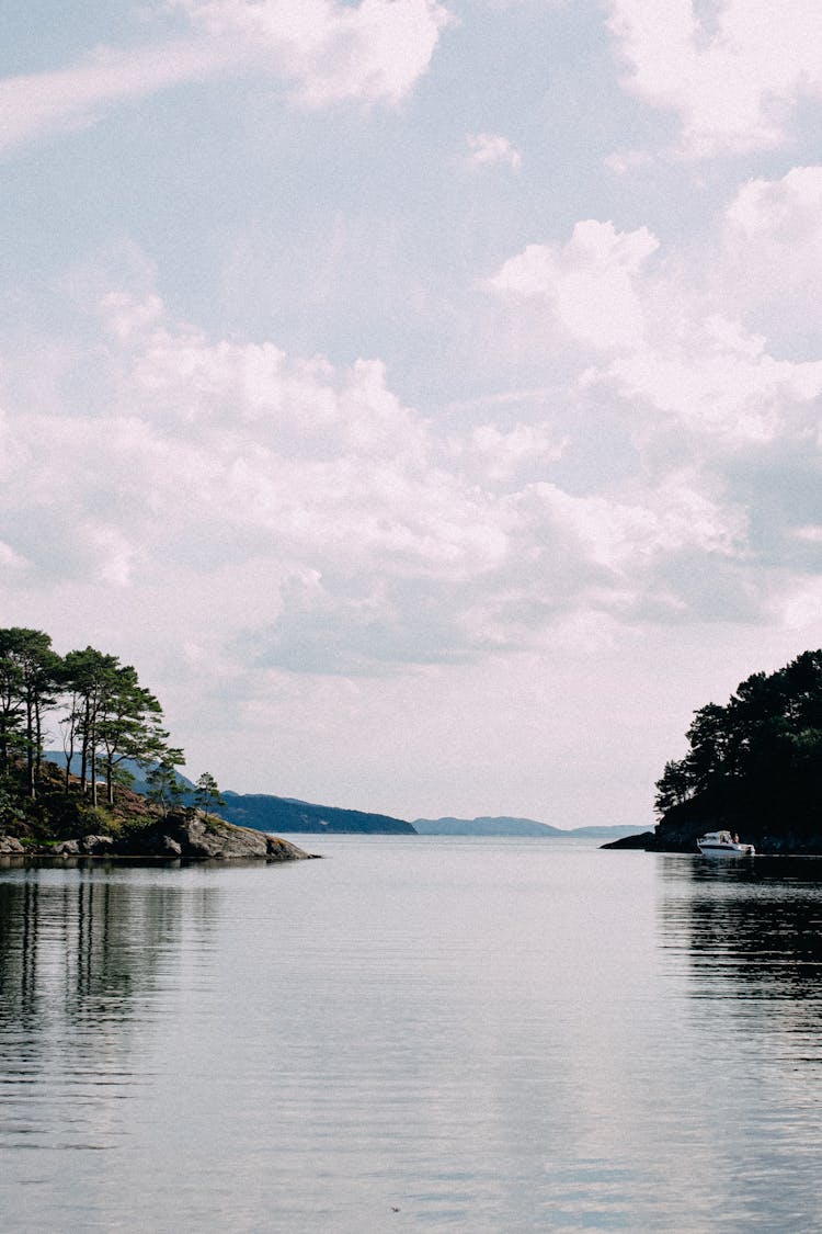 A Calm Lake Under White Clouds