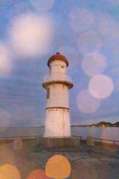 Captured at dusk, a lighthouse in Montreal, Canada with a soft bokeh effect.