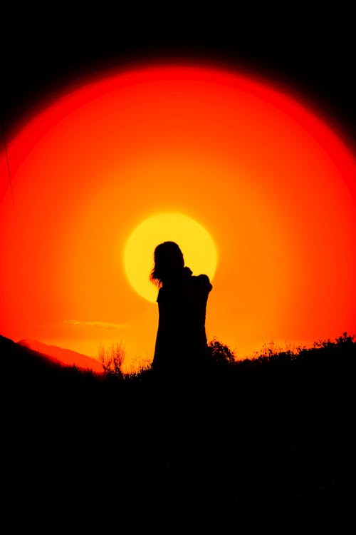 Free Silhouette of a Person during Sunset Stock Photo