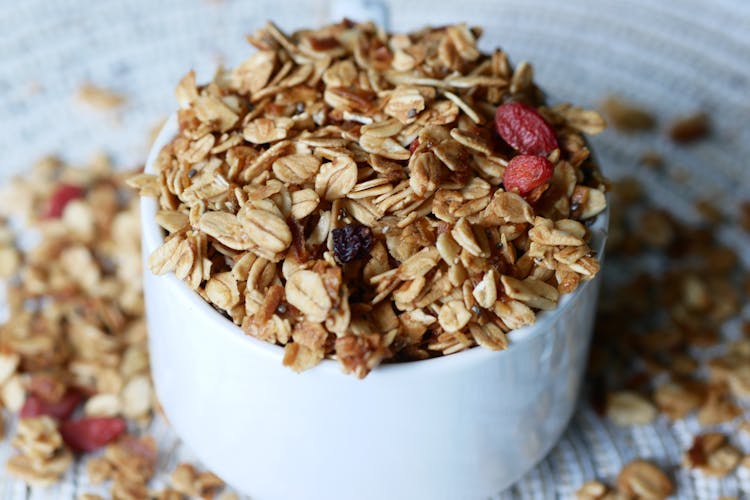 Oatmeal With Raisins On White Bowl 