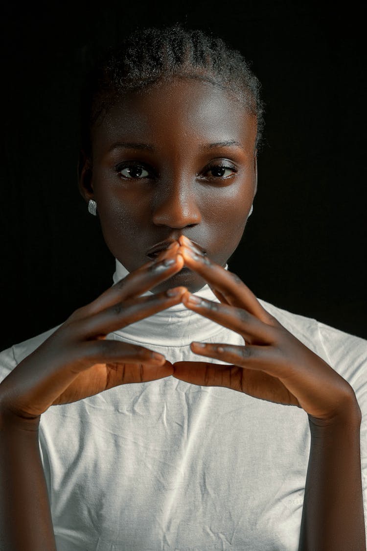 Portrait Of A Woman In White Turtleneck Top 