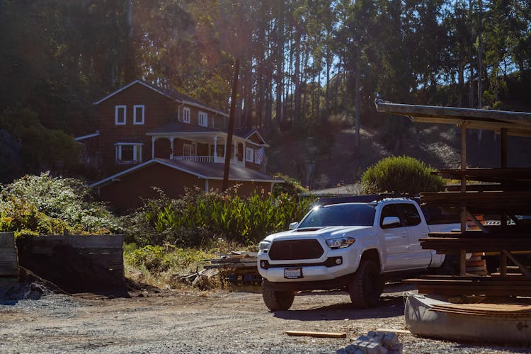 White Pick Up Truck Parked In The Driveway