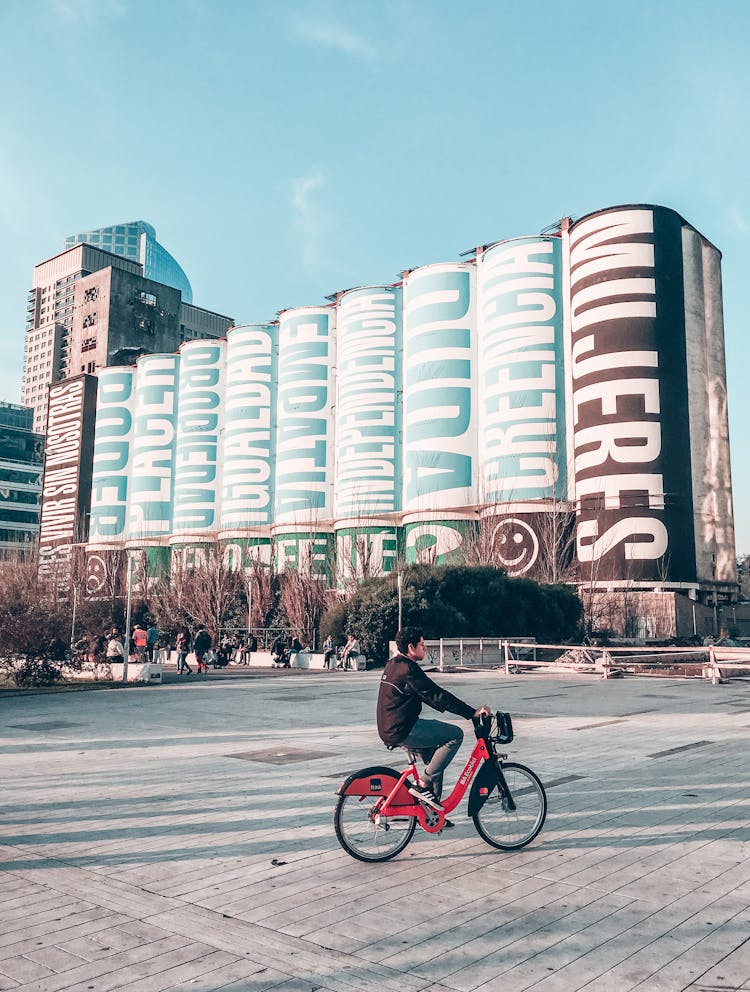 A Person Biking On The Road