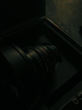 Detailed view of a professional camera lens inside a protective case, highlighting its intricate design.