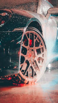 Dynamic shot of a luxury car wheel in motion, emphasizing speed and elegance.
