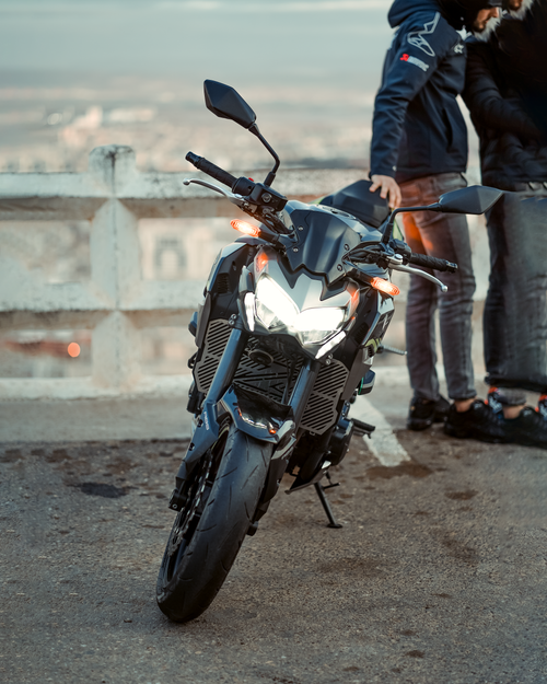 Free Dynamic view of a motorcycle with riders on a bridge in Oran, Algeria, highlighting urban exploration. Stock Photo