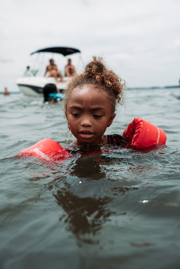 A Young Girl Swimming In The Sea 