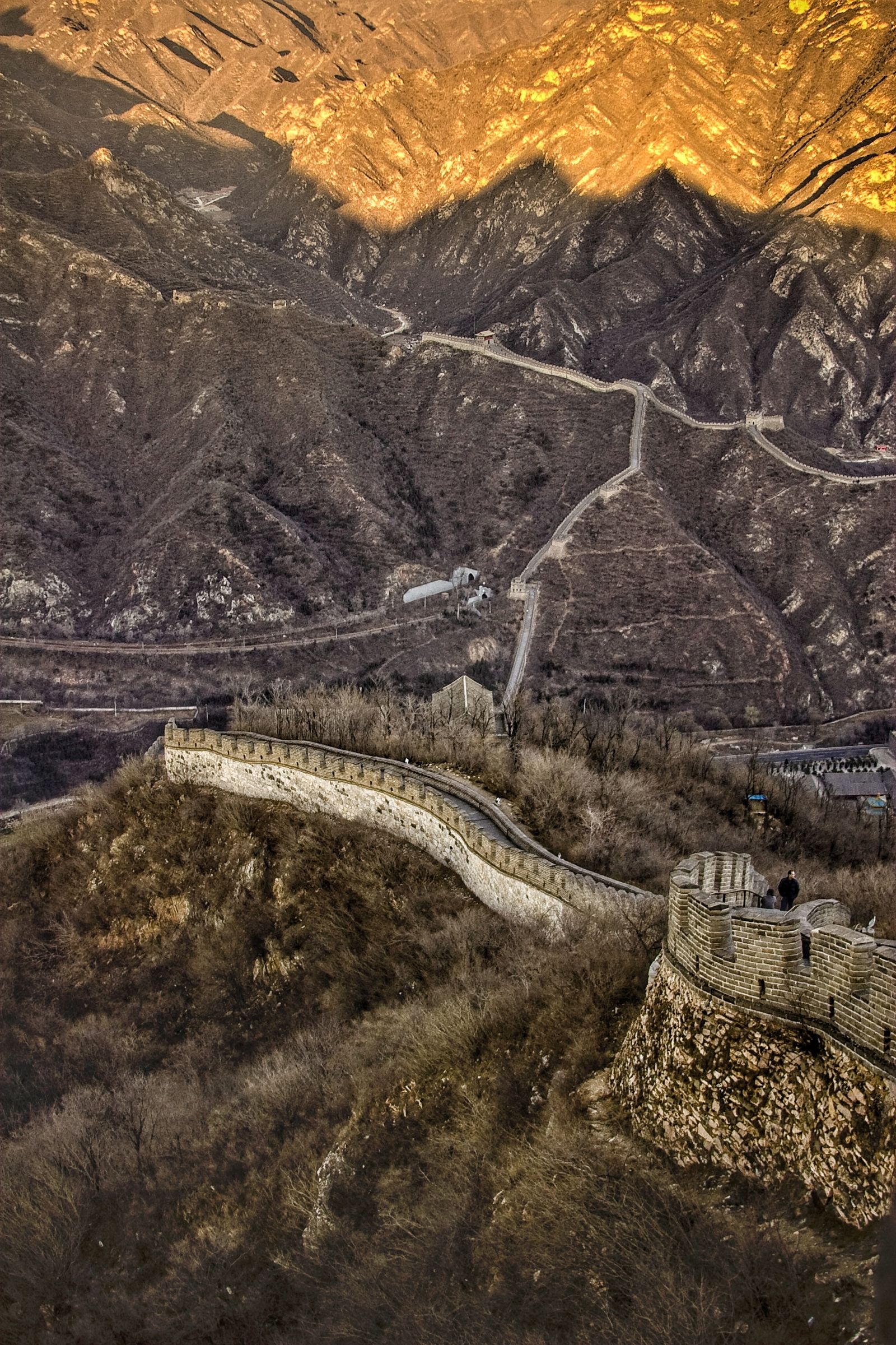 Aerial view of the Great Wall of China winding across mountain terrain