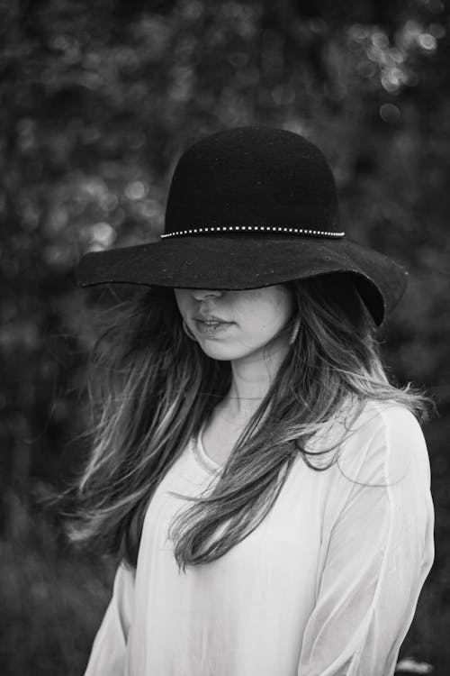 Free A Portrait of a Woman in a Sun Hat Stock Photo