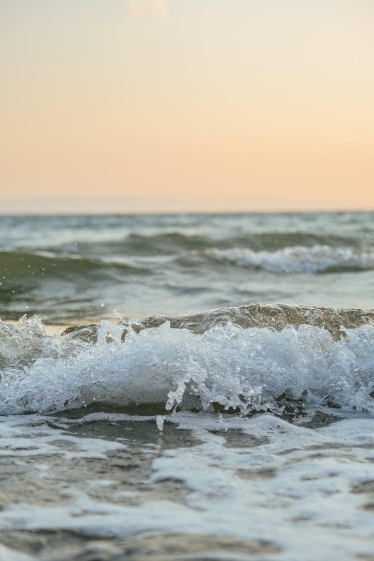 Foam Forming On Small Wave By Shore