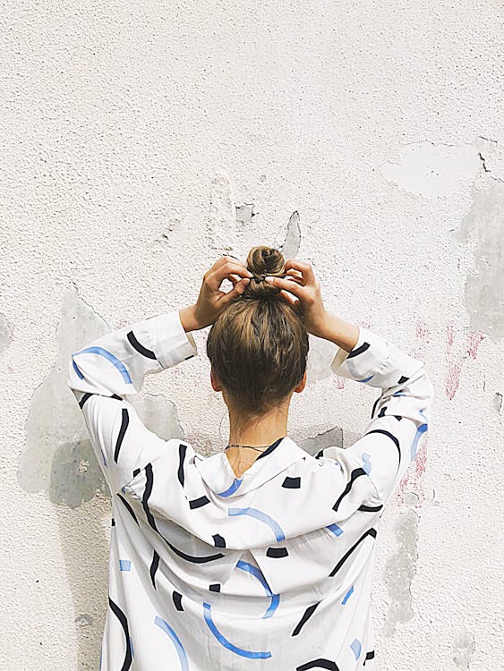 Woman Holding Pony Tail