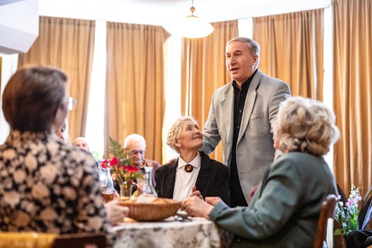 Senior man delivers a heartfelt toast at a cozy family gathering in a restaurant setting.