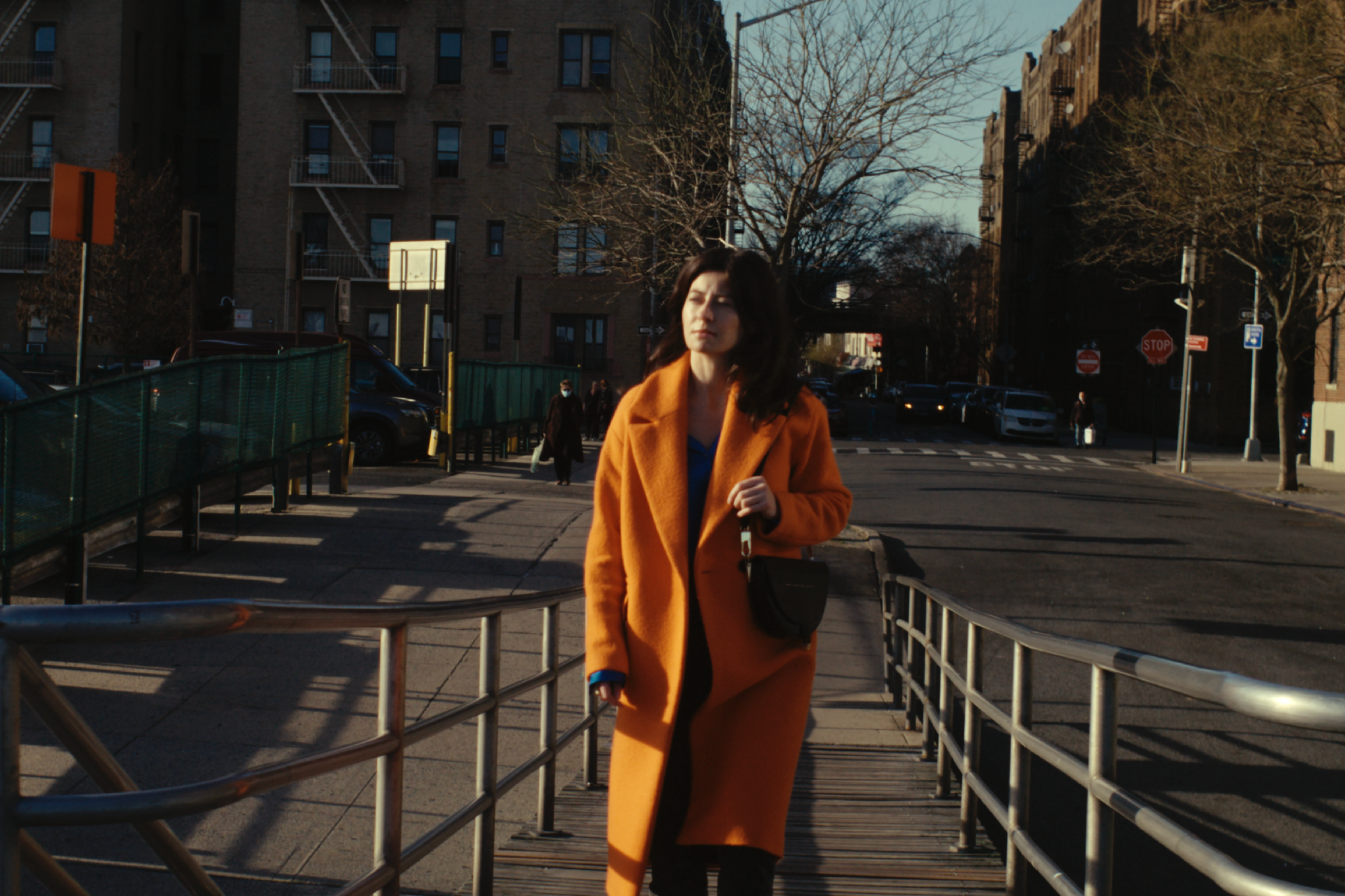 A Woman in Orange Trench Coat · Free Stock Photo