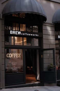 Inviting entrance to Brew Coffeeworks with stylish signage and warm lighting.