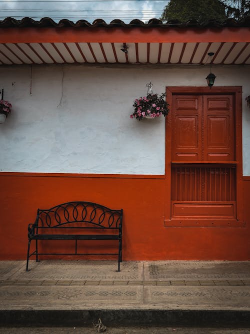 Free Bench Beside a Wooden Window Stock Photo