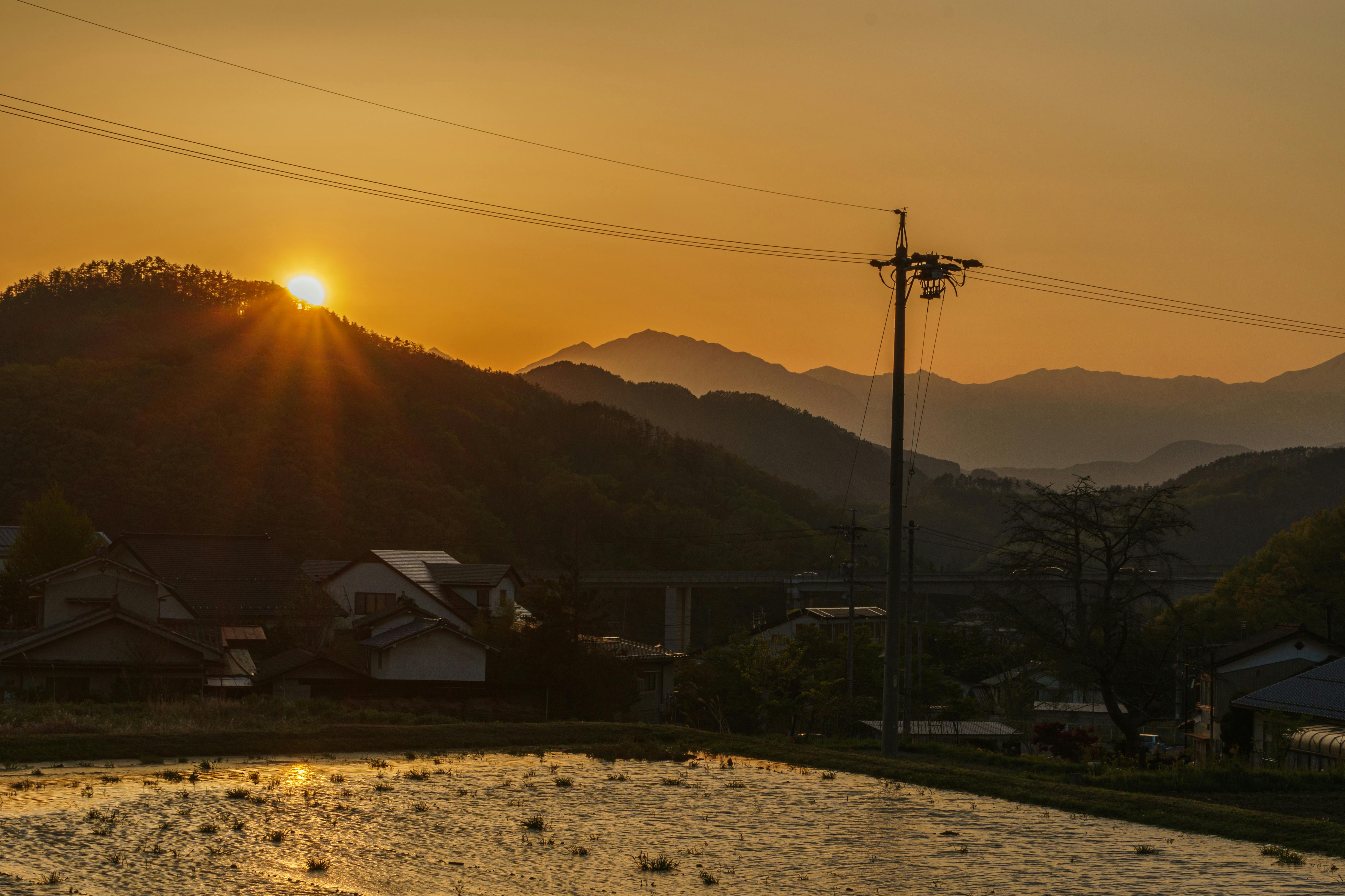 Peaceful sunset view over rice fields and mountains in Nagano, Japan