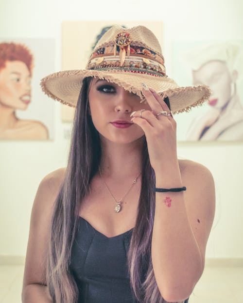 A Woman wearing Brown Hat 