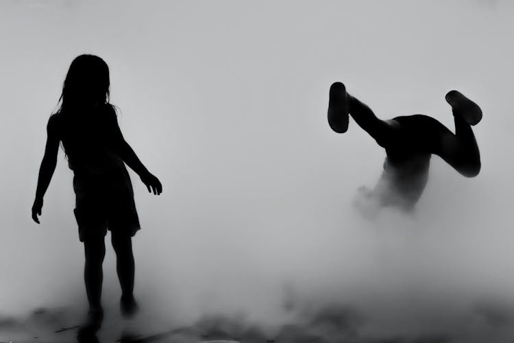Silhouette Of Children Playing