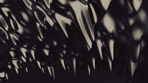 Free An abstract art image featuring dark, oblique, spiky shapes with a glossy texture. Stock Photo