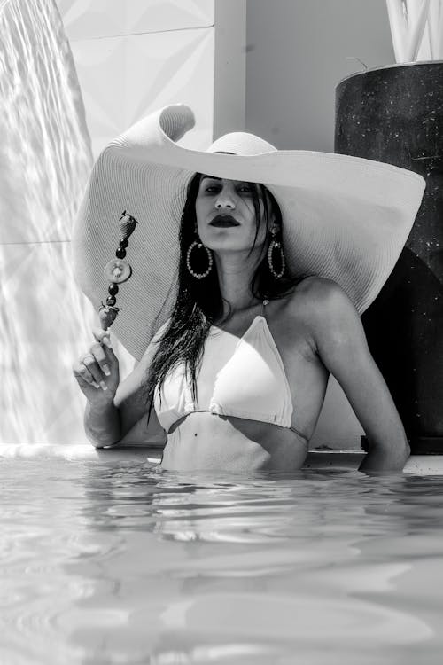 Woman in White Bikini Top and Sun Hat 