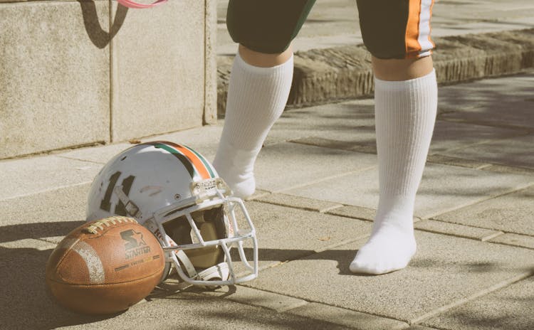 Helmet And Football On The Floor