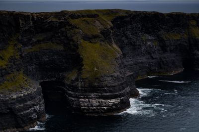 Rugged Irish sea cliffs with waves below, photo by Kate Kerr on Pexels
