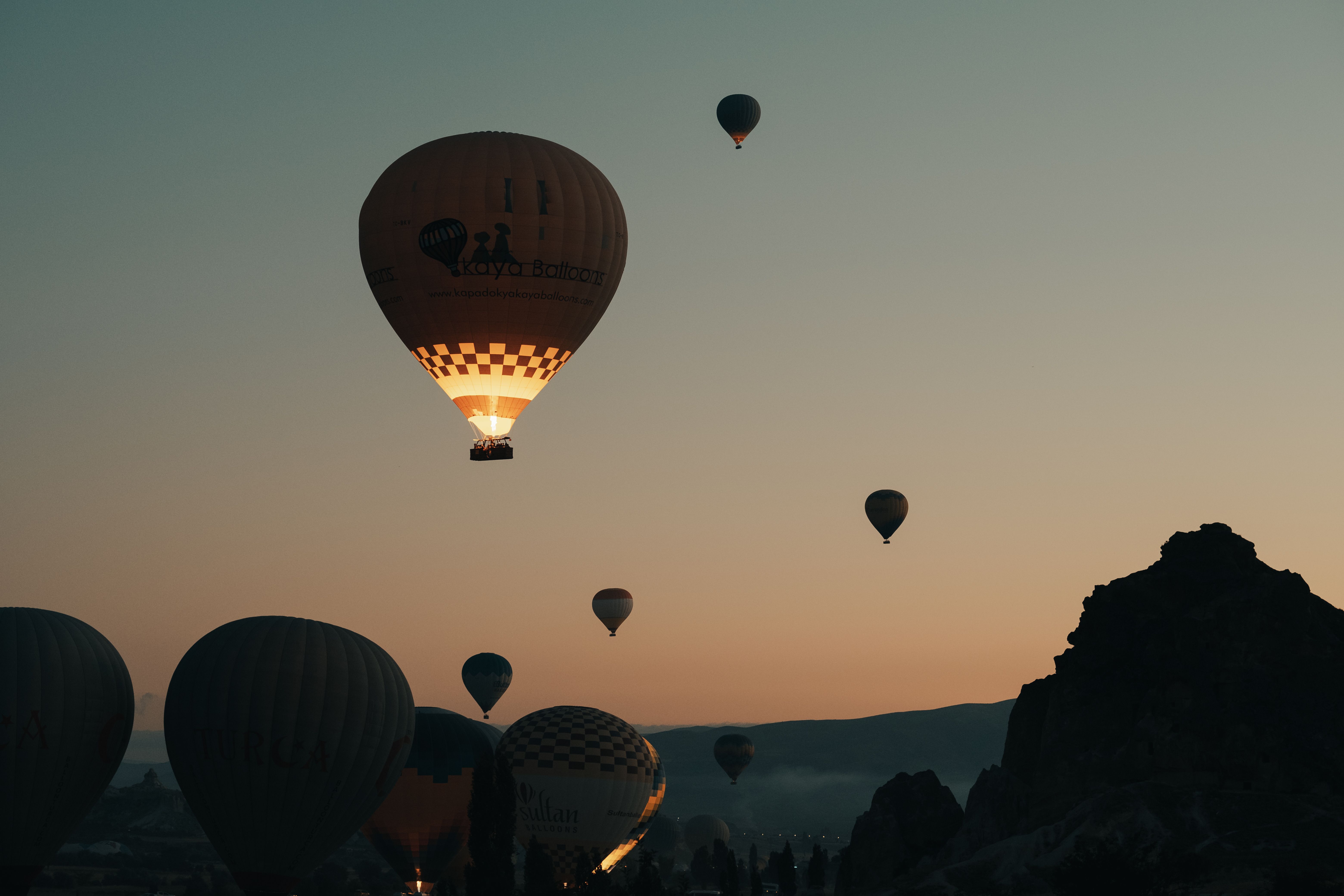 Hot air balloons rising over the West Bank of Luxor at sunrise