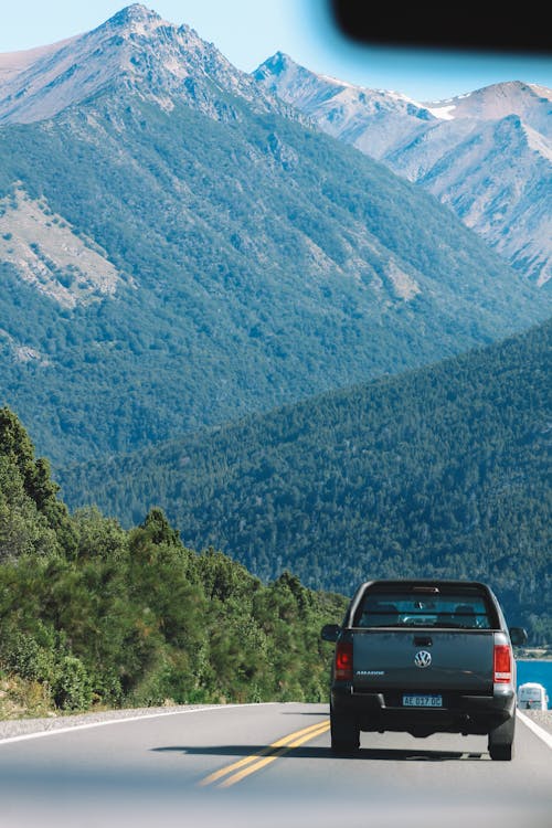 Pick Up Truck Driving Towards the Mountains